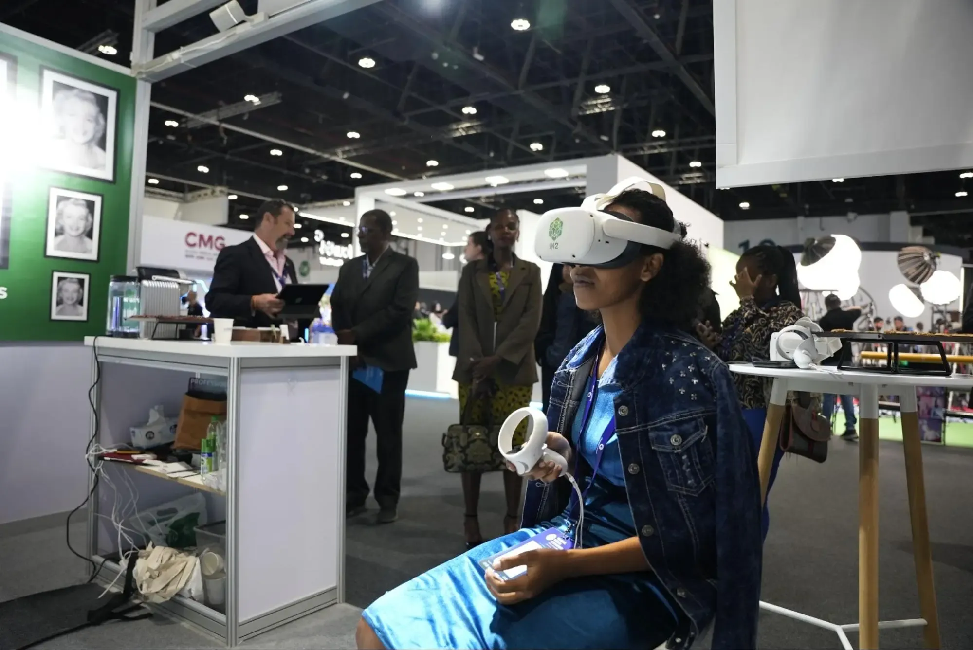 “A conference attendee experiencing virtual reality (VR) at the IN2 booth”